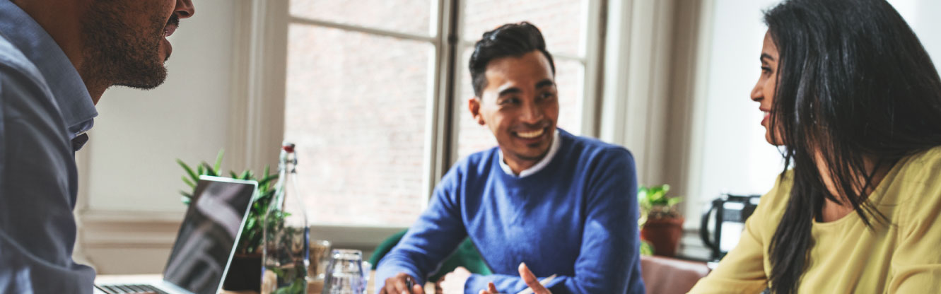 Three people having a meeting